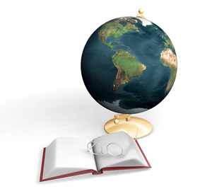 Image of a Bible and glasses in front of world globe